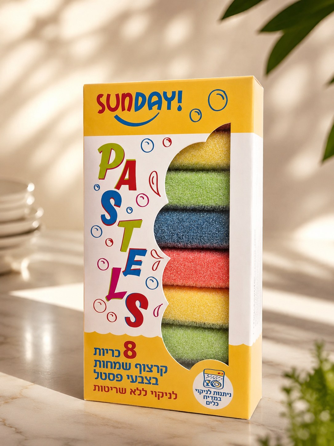 Sunday Pastels retail pack with eight colorful cleaning pads on a sunlit marble counter